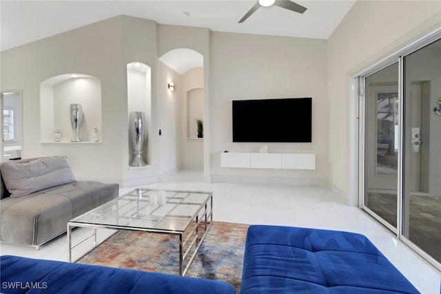 tiled living room featuring lofted ceiling and ceiling fan