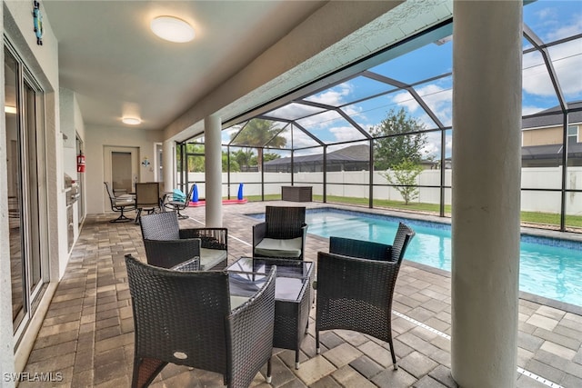 view of patio featuring a lanai and a fenced in pool