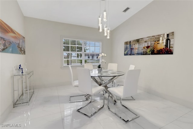 dining area with vaulted ceiling