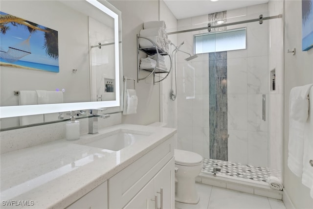 bathroom with tile patterned flooring, a shower with shower door, toilet, and vanity