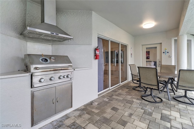 kitchen with wall chimney range hood