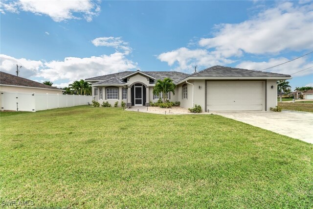 single story home with a front yard and a garage