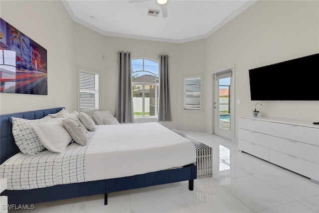 bedroom with a towering ceiling, ceiling fan, access to outside, and ornamental molding