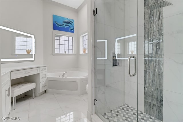 full bathroom featuring plenty of natural light, shower with separate bathtub, toilet, and vanity