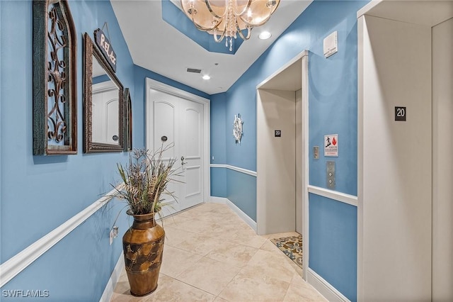 2090 W First St Unit 2007, Fort Myers, FL 33901 - hall with tile patterned floors, visible vents, baseboards, and a chandelier