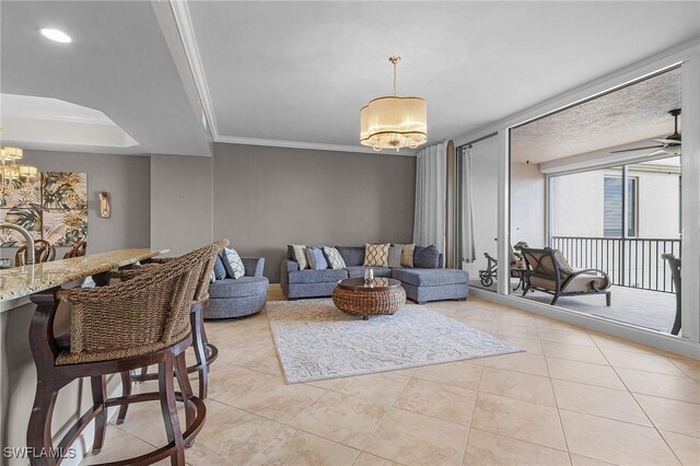 2090 W First St Unit 2007, Fort Myers, FL 33901 - living room with light tile patterned flooring, ceiling fan with notable chandelier, and ornamental molding