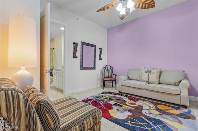 living room featuring light tile patterned floors and ceiling fan