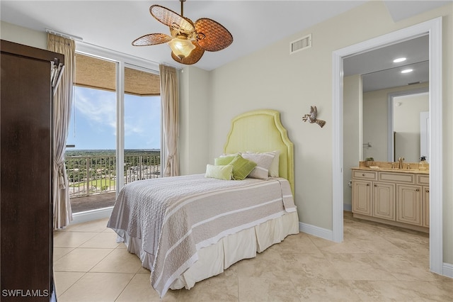 tiled bedroom with access to exterior, ceiling fan, sink, and connected bathroom