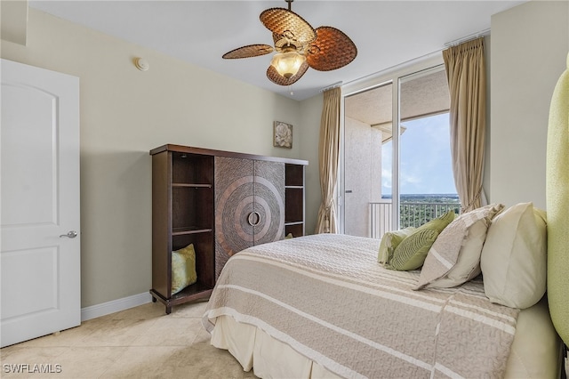 bedroom with access to exterior, ceiling fan, and light tile patterned floors