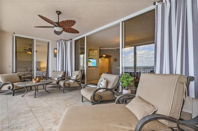 2090 W First St Unit 2007, Fort Myers, FL 33901 - exterior space featuring tile patterned flooring, a ceiling fan, arched walkways, and expansive windows