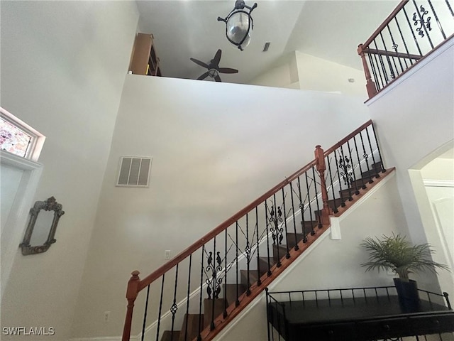 stairway with high vaulted ceiling