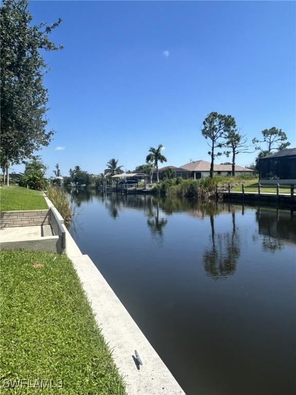 property view of water featuring a boat dock