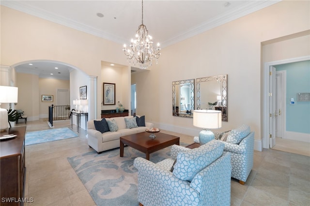 living room featuring a chandelier, light tile patterned floors, crown molding, and a high ceiling