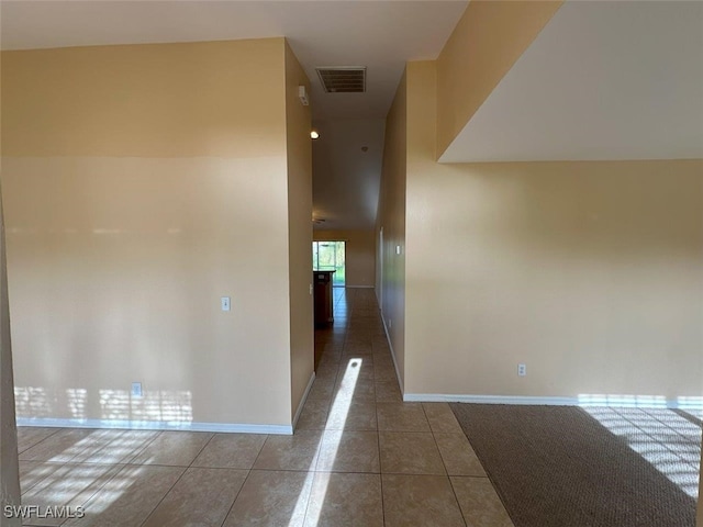 corridor featuring tile patterned flooring