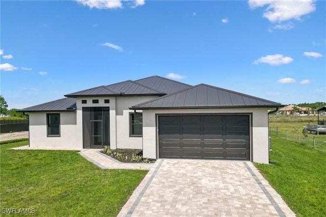 view of front facade with a garage and a front yard