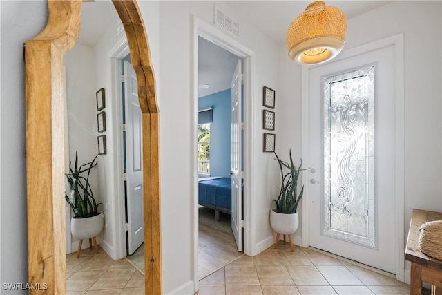 foyer with light tile patterned flooring