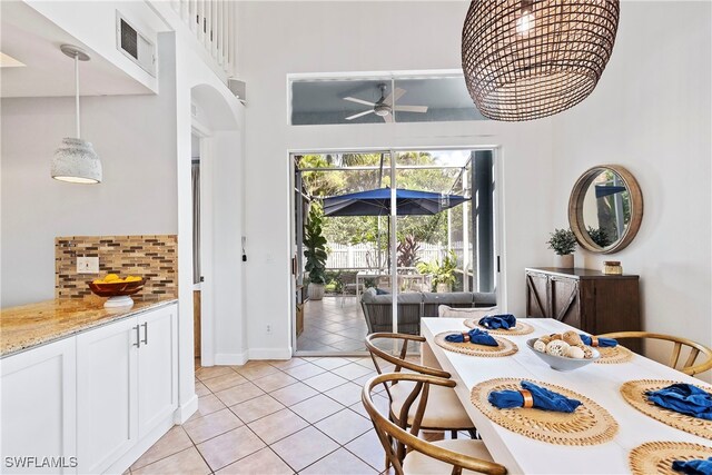 dining room featuring light tile patterned flooring and ceiling fan