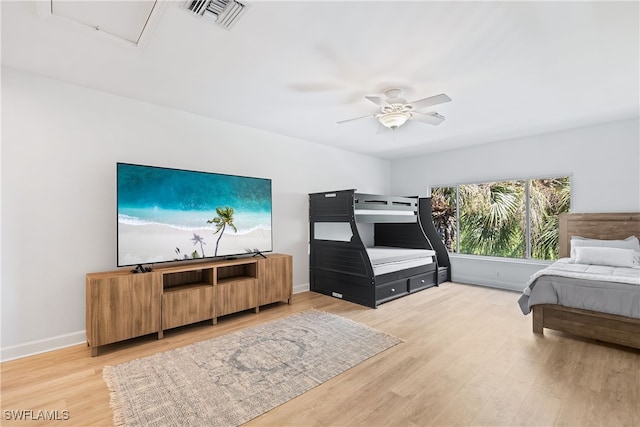 bedroom with ceiling fan and hardwood / wood-style flooring