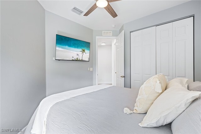 bedroom featuring ceiling fan and a closet