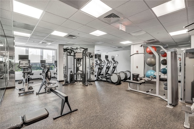 exercise room featuring a drop ceiling