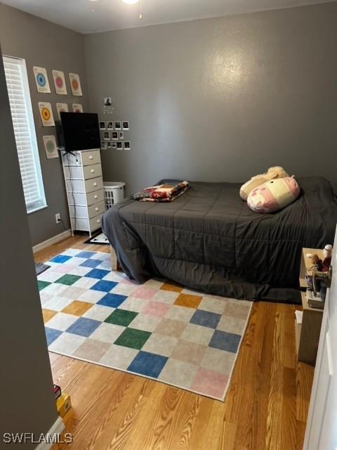 bedroom with light hardwood / wood-style flooring