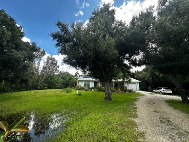 view of yard featuring a garage