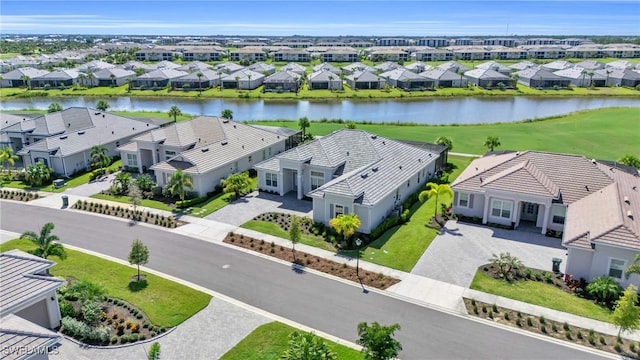 birds eye view of property with a residential view and a water view