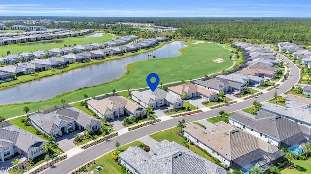 birds eye view of property with a residential view, a water view, and golf course view