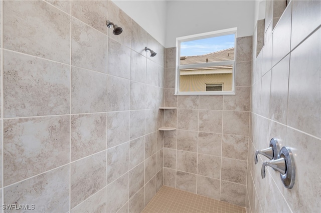 bathroom featuring tiled shower