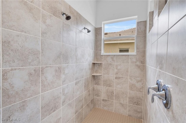 full bathroom featuring a tile shower