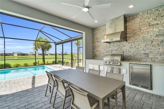 interior space with ceiling fan and grilling area