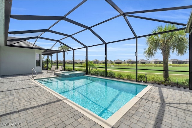 view of pool with a lanai, a patio, and an in ground hot tub