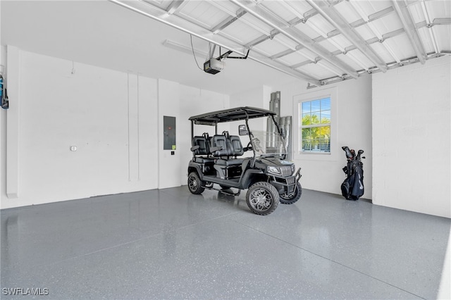 garage featuring a garage door opener and electric panel