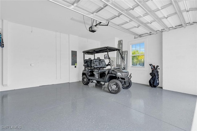 garage with electric panel and a garage door opener