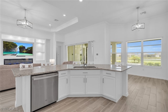 kitchen with dishwasher, light wood-type flooring, white cabinetry, and an island with sink