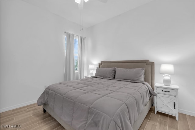 bedroom featuring ceiling fan and light hardwood / wood-style floors