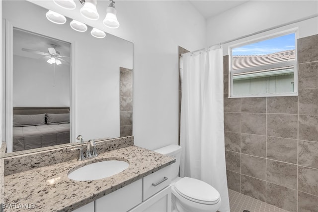 bathroom featuring toilet, walk in shower, tile patterned floors, vanity, and ceiling fan