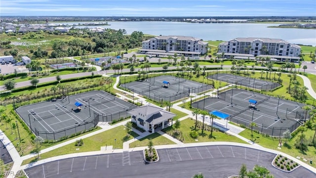 birds eye view of property with a water view