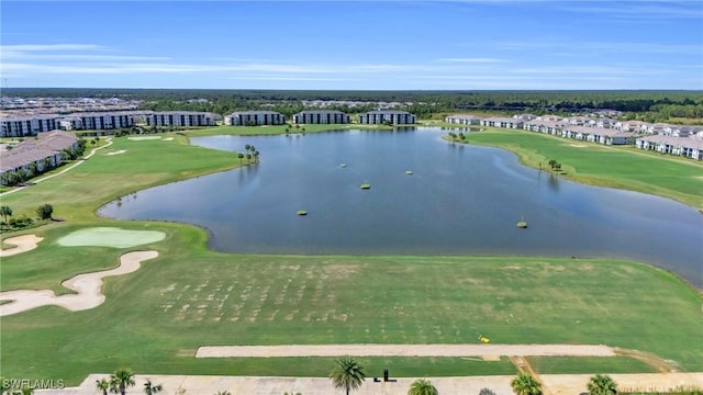 bird's eye view with view of golf course and a water view