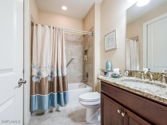 full bathroom with toilet, vanity, and shower / tub combo with curtain