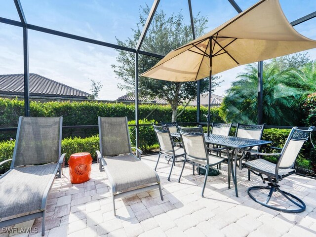 view of patio with a lanai