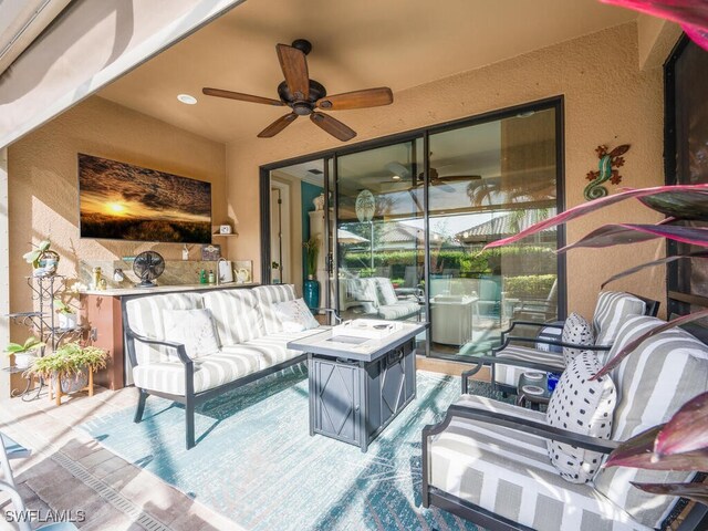 view of patio / terrace featuring an outdoor living space and ceiling fan