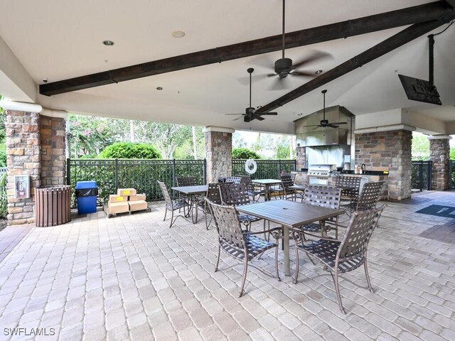 view of patio featuring ceiling fan, area for grilling, and grilling area