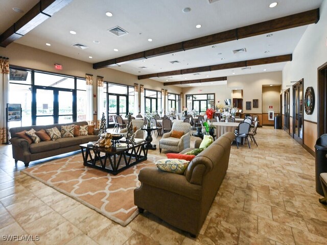 living room with beamed ceiling