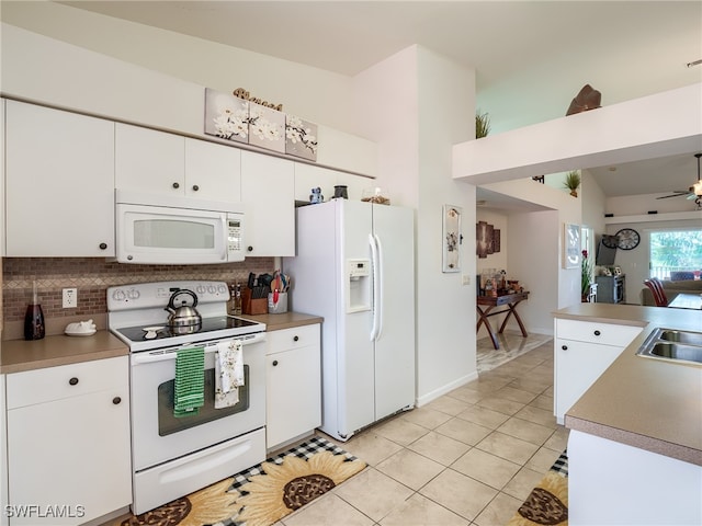 kitchen featuring ceiling fan, white appliances, white cabinetry, and light tile patterned flooring