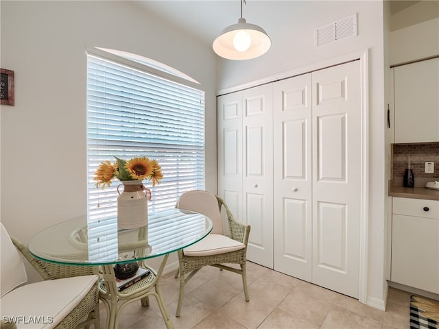 dining area with light tile patterned flooring