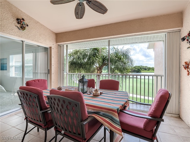 sunroom featuring ceiling fan and a wealth of natural light