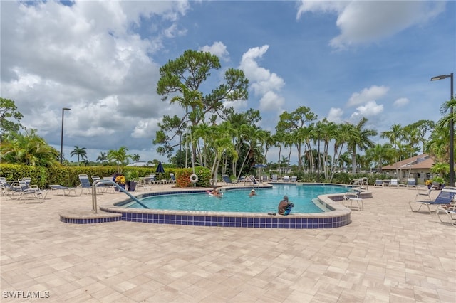 view of pool featuring a patio area