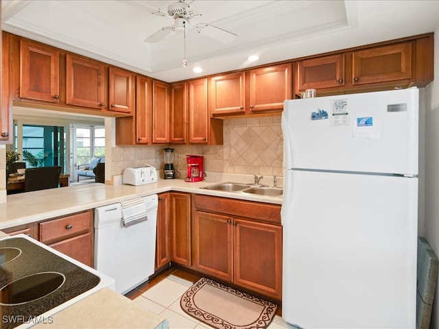 kitchen featuring white appliances, crown molding, sink, ceiling fan, and light tile patterned flooring