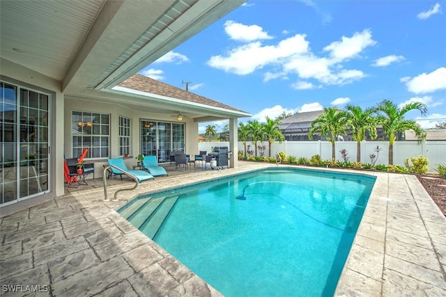 view of pool featuring a patio area and ceiling fan